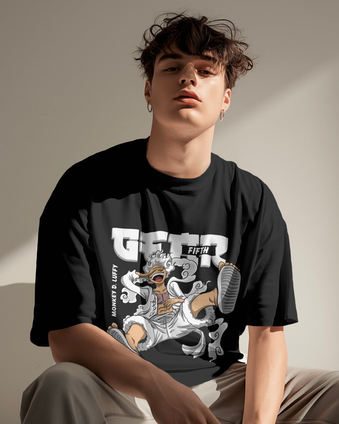 Luffy Gear 5 Unisex Oversized One Piece t-shirt, an anime t-shirt made from durable 180 GSM 100% cotton. Features a pre-shrunk unisex fit with a Lycra ribbed neck for a snug, comfortable fit, perfect for anime fans.In black colour from front.